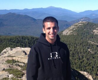 Craig gets his picture taken on top of the mountain SheeksFreaks Financial Skills for Young Adults