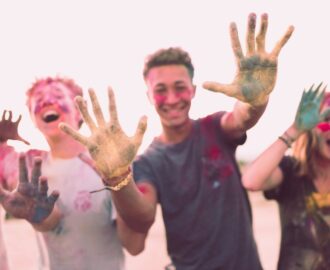 four teens enjoy fingerpainting while they take a break from school work SheeksFreaks Financial Skills for Young Adults