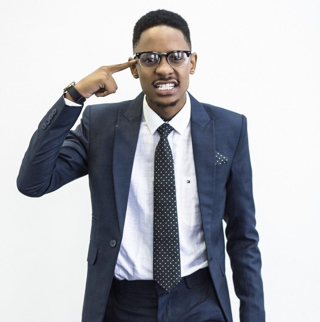 young man in suit and polka dot tie has hand to his head in frustration and confusion about credit scares SheeksFreaks Financial Skills for Young Adults